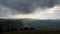 Magnificent mountain landscape at sunrise. Storm clouds in the sky.