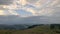 Magnificent mountain landscape at sunrise. Storm clouds in the sky.