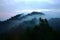 Magnificent mountain surrounding with misty fog in Malaysia