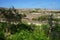 Magnificent mountainous landscape, classic buildings and exotic vegetation in L-Ahrax, Mellieha, Malta.