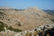 Magnificent mountainous landscape with Mediterranean vegetation in August. Kolympia, Rhodes, Greece