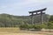 Magnificent Otorii gate of Torii Shrine near the tree-covered hills captured in Tanabe, Japan