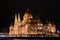The magnificent Parliament building in Budapest, right on the banks of the Danube at night