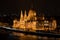 The magnificent Parliament building in Budapest, right on the banks of the Danube at night