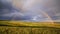 Magnificent rainbow over the forest and steppe