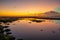 Magnificent seascape. Beach at sunset during low tide. Sunset golden hour. Sunlight reflection in water. Bingin beach, Bali,