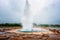 Magnificent Strokkur Geyser erupts the fountain of water, Haukadalur geothermal area, Iceland