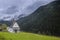 Magnificent summer sunset in Tirol. Chapel of St. Mary Magdalene