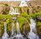 The magnificent summer view of Dynjandifoss Dynjandi Waterfall, jewels of the Westfjords, Iceland. The biggest waterfall in West