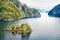 Magnificent summer view with small island with typical Norwegian building on Lovrafjorden flord, North sea. Colorful morning view