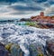 Magnificent summer view of Torre di Bari tower. Stormy morning scene of Sardinia island, Italy, Europe. Wonderful seascape of Medi