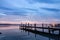 Magnificent sunset wooden Pier on the lake. A tranquil sunset over a Varna lake