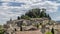 Magnificent view of the ancient hilltop village of Cetona, Siena, Italy, on a beautiful sunny day with some white clouds