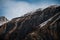 Magnificent view of massive high mountain with snowy peaks.