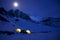 Magnificent view of the snow-capped mountains in a moonlit night.
