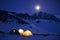 Magnificent view of the snow-capped mountains in a moonlit night.