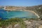 Magnificent views of Riviera Beach and the small watchtower Ghajn Tuffieha Tower, limits of Mgarr, Mellieha, Malta.