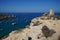 Magnificent views of Riviera Beach and the small watchtower Ghajn Tuffieha Tower, Mellieha, Malta.