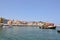 Magnificent Views Of Venetian Harbor Neighborhood And Its Hermitage In Chania With Two Beautifuls Ship In The Picture. History Arc