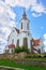 A magnificent white Church with a red roof. Old Catholic Church