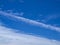 Magnificent white Contrail Cirrus cloud in blue sky. Australia.