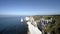 Magnificent white rocky beach and blue sea on horizon. Action. Top view of majestic white cliffs with blue sea at foot