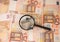 Magnifier focused on keys of apartment. Apartment loan