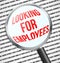 Magnifier glass over Looking for employees text