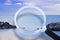 Magnifying glass against a calm ocean - Research, observation and surveillance concept