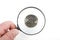 Magnifying glass and ancient coins
