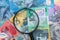 Magnifying glass on australian dollar banknote as background