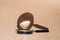 Magnifying glass on a beige background with sun reflection