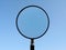 Magnifying Glass on blue sky background