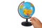 Magnifying Glass on Earth Globe on White