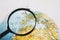 magnifying glass near globe. High quality photo