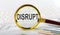 Magnifying glass with the word DISRUPT on chart background