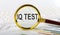 Magnifying glass with the word IQ TEST on the chart background