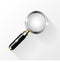 Magnifying silver glass on a gray background