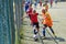 Magnitogorsk, Russia, - August, 8, 2014. The boys play football in the yard, enclosed with a fence of metal mesh