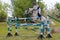 Magnitogorsk, Russia, - June, 14, 2014. A rider on a white horse jumps over a high barrier during a performance at Sabantuy - the