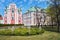 Magnolias blooming in spring and facade of the Baroque Catholic Church