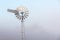 Magpies perched on a windmill in rural Queensland, Australia