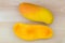 Maha chanok Rainbow mango cut in half showing yellow orange texture