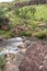 Mahai River crossing after heavy rains on a hiking trail