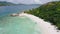 Mahe, Seychelles exotic beach with tourist boat, blue lagoon and palm trees. Aerial view travel relax vacation concept