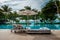 Mahe Seychelles , luxury swimming pool with chairs at the Four Season resort in the mountains La Digue tropical Island