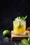 Mai Tai Classic rum cocktail. Tropical lemonade with lime on black. Vertical format