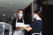 maid in medical mask giving clean