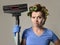 Maid service woman or upset housewife in hair rollers cleaning g