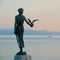 Maiden with Seagull standing on the rock in Opatija, Croatia